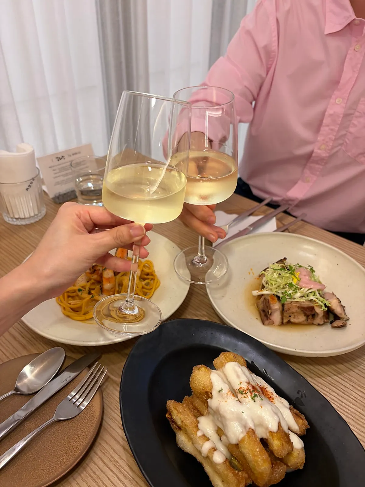 Wine glasses toasting for the anniversary