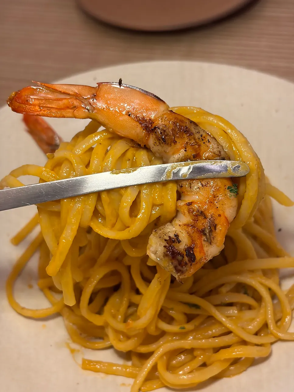 Bisque pasta topped with big shrimp