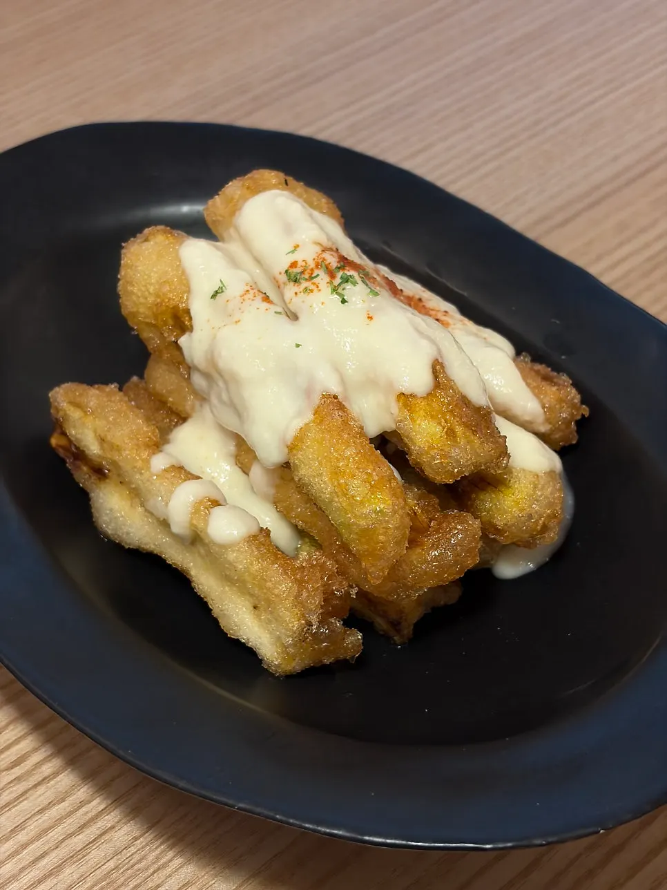 Crispy fried eggplant topped with fish cream sauce