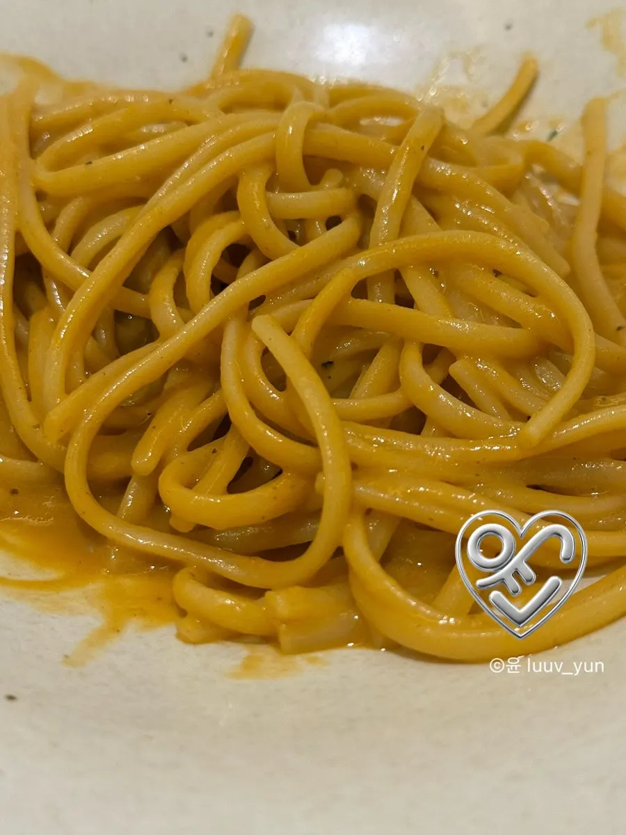 Close-up of bisque pasta noodles coated in sauce