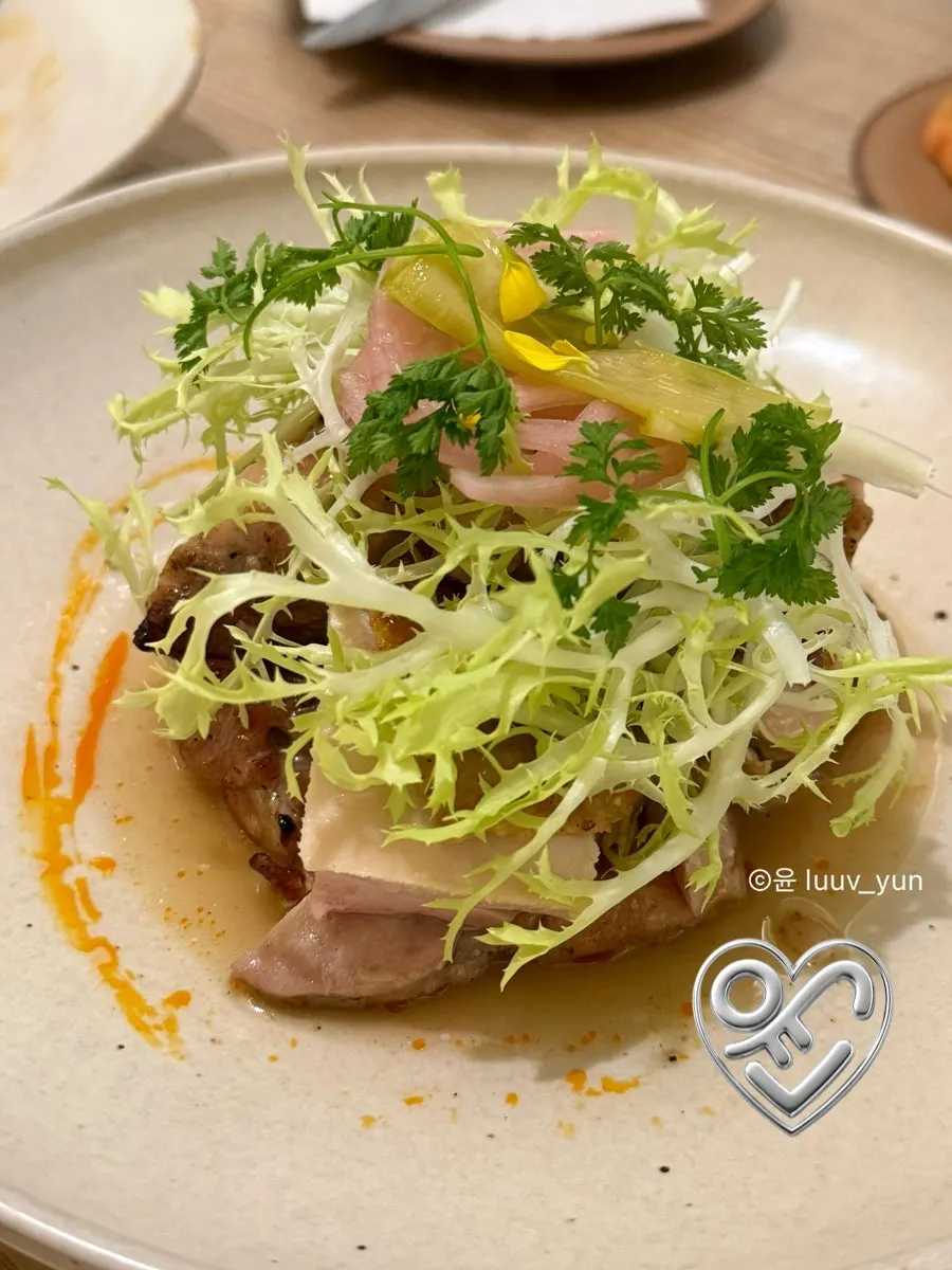 Grilled chicken thigh served over yuzu sauce