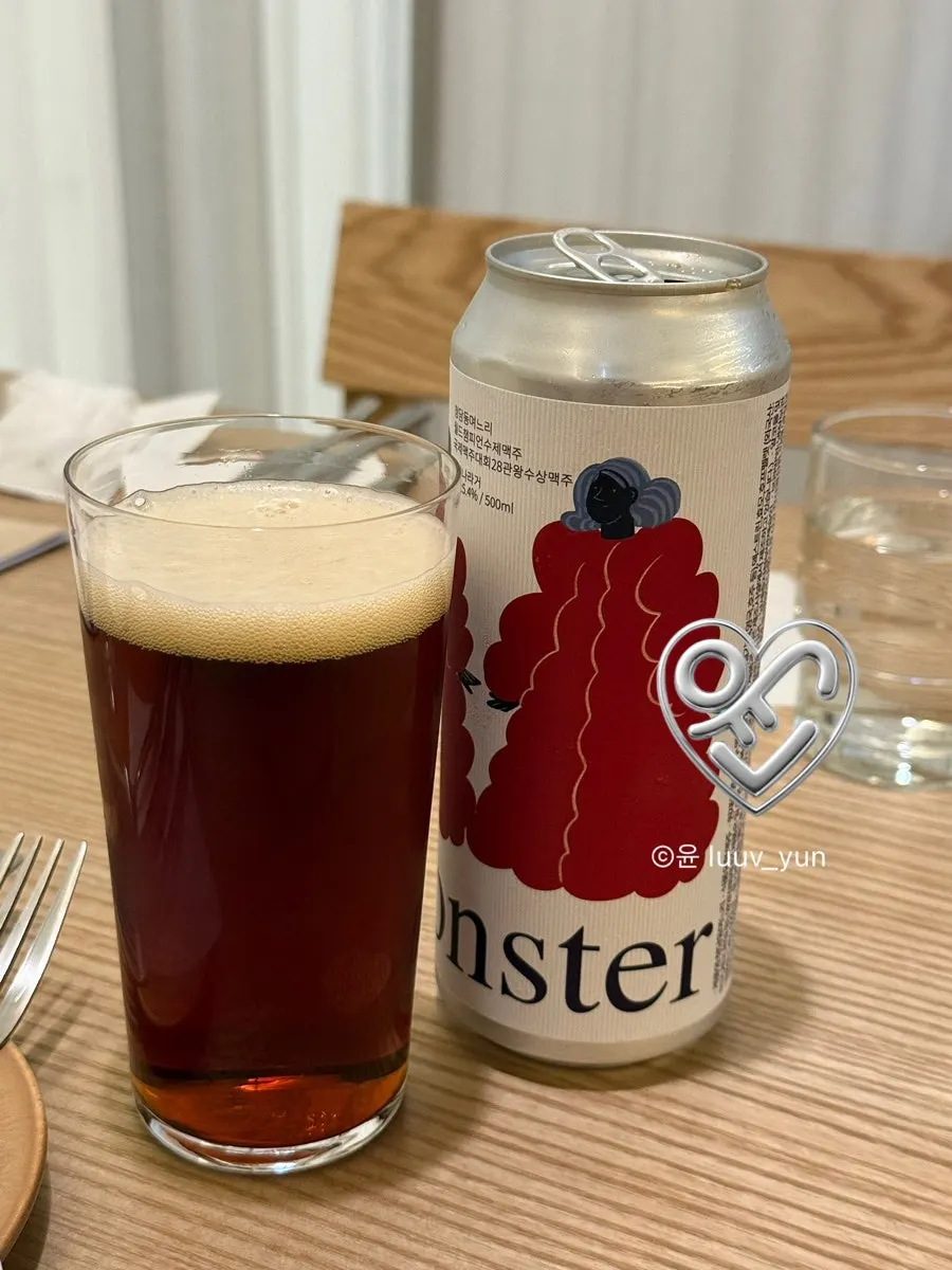 A glass of craft beer placed alongside the dishes