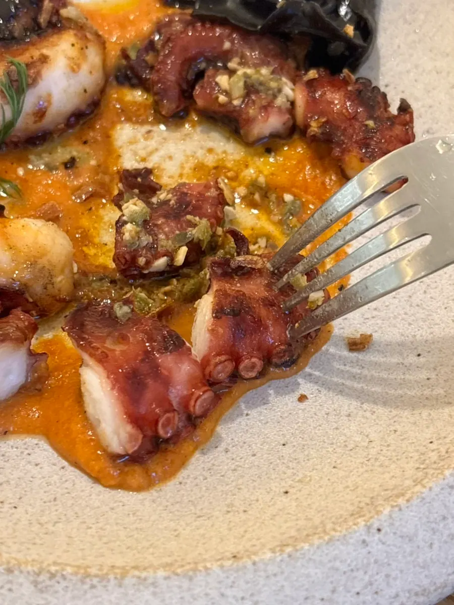 Close-up of the large charcoal-grilled octopus
