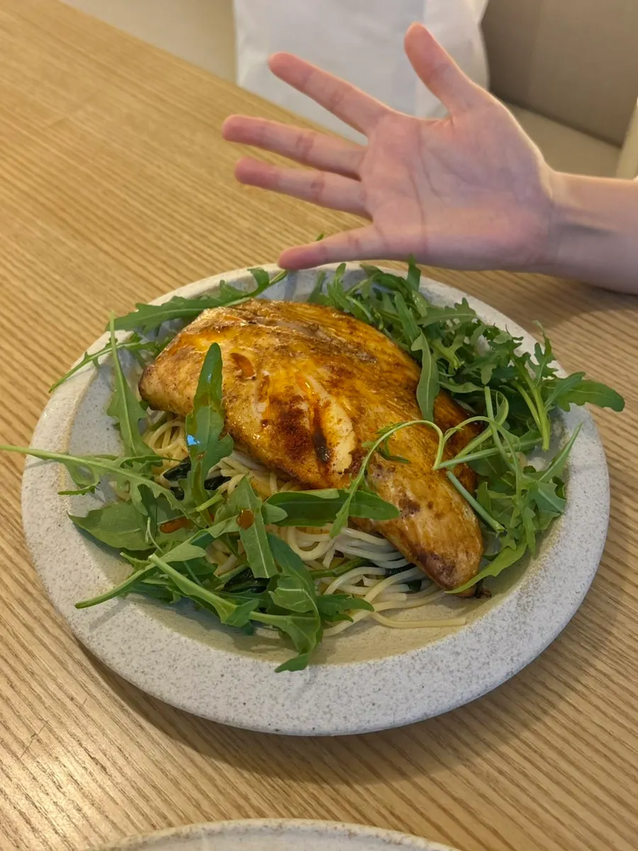 Mackerel pasta with a large piece of mackerel on top