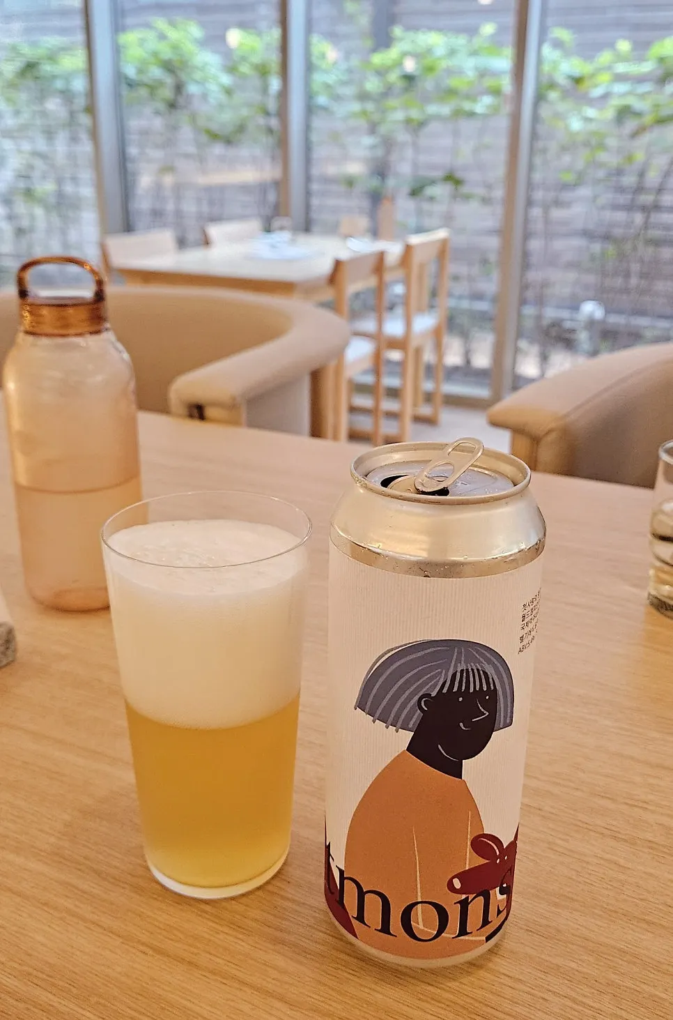 A glass of Cheotsarang beer poured with lots of foam