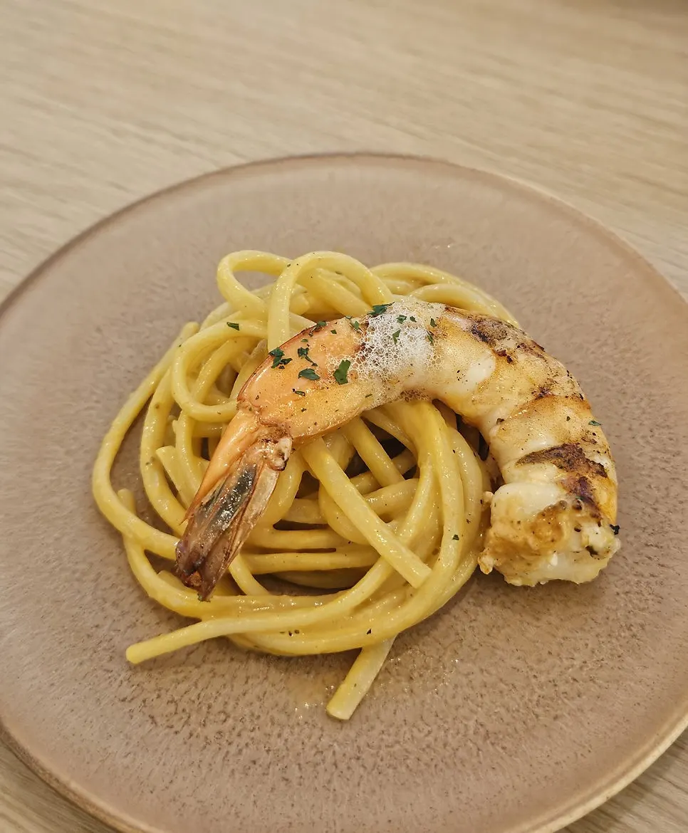 Close-up of the large shrimp on the bisque pasta