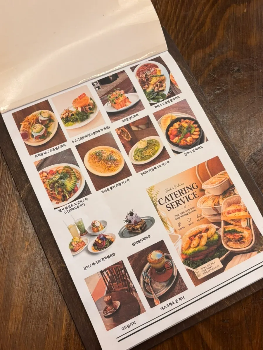 Menu board listing sandwiches and omelettes