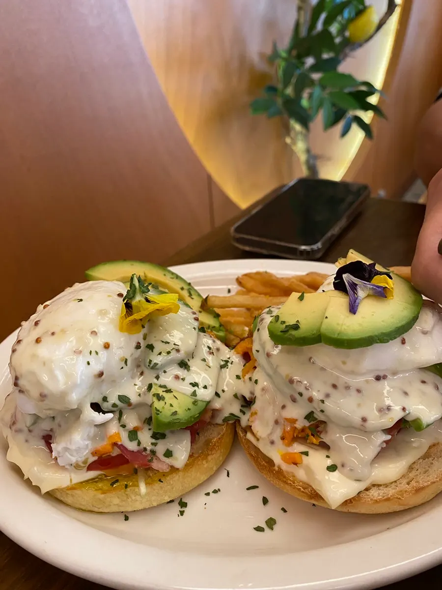 Close-up of the open sandwich topped with poached egg and avocado