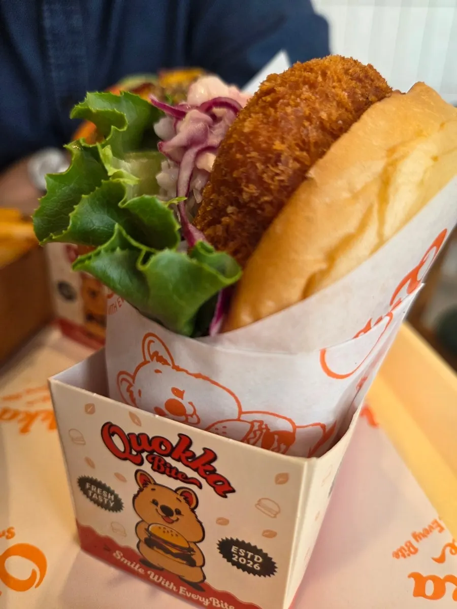 Cross-section of the shrimp burger packed with whole shrimp