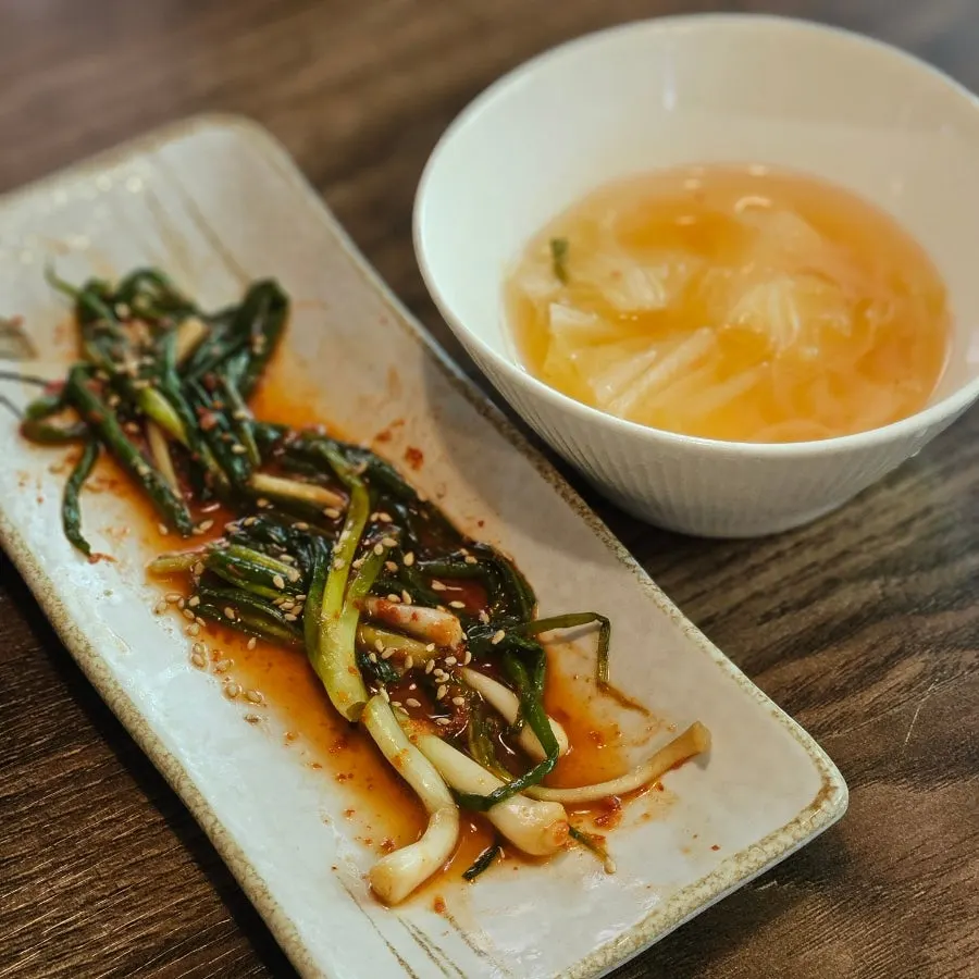 A plate of sauces and ssamjang for dipping