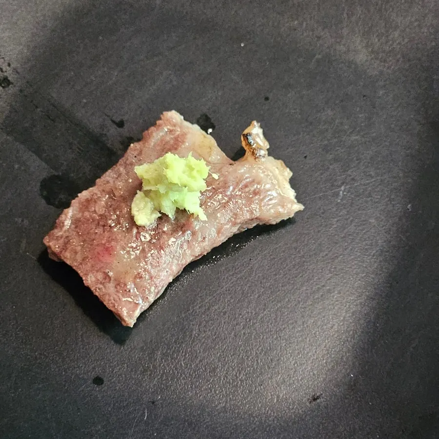 A grilled piece of Ravi Plain Grilled Ribs