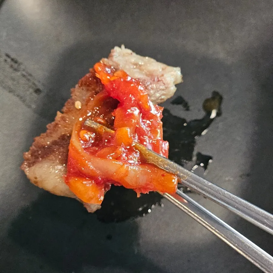 A piece of plain grilled ribs eaten with side dishes