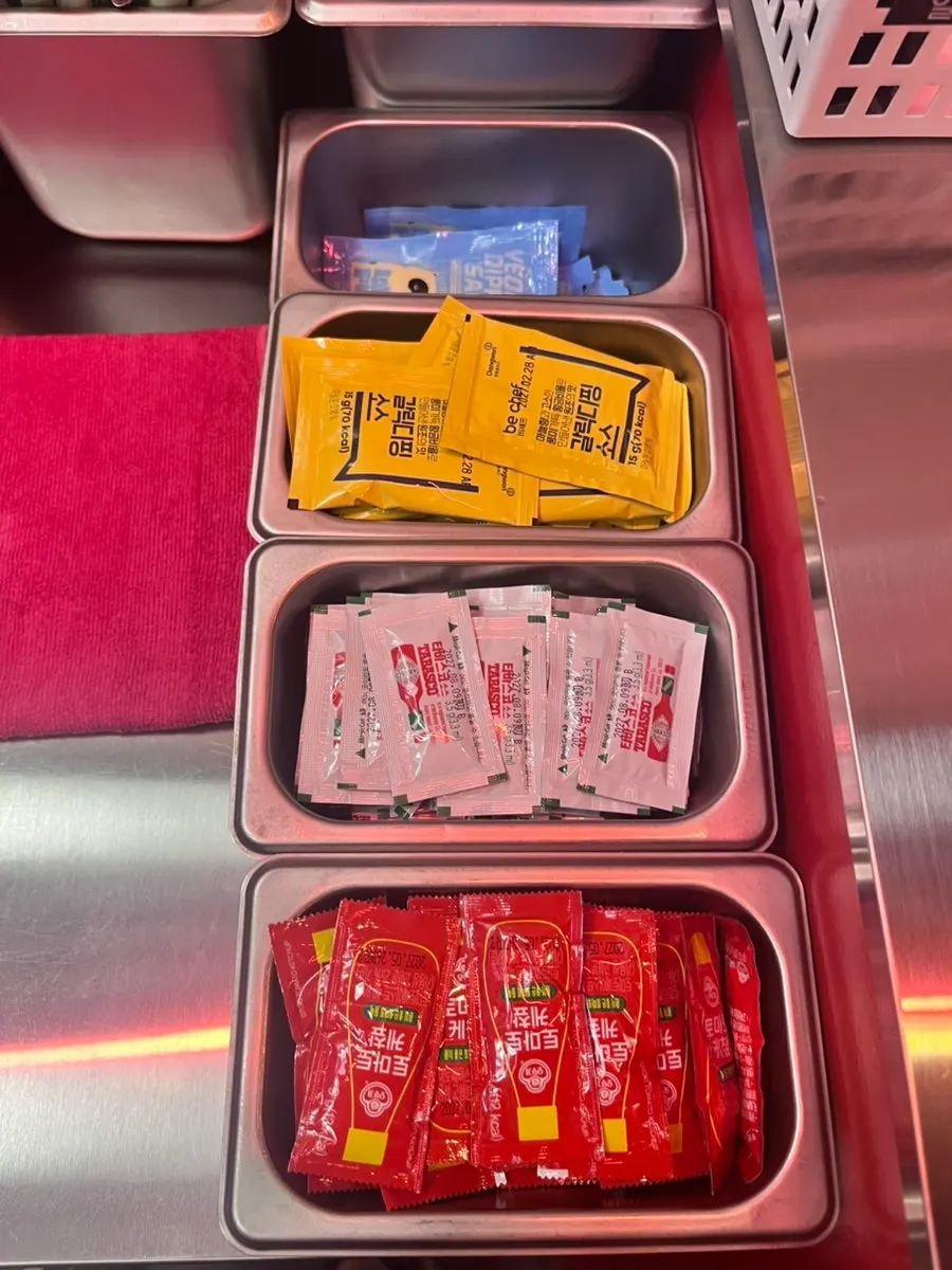Self-serve bar corner with condensed milk and forks