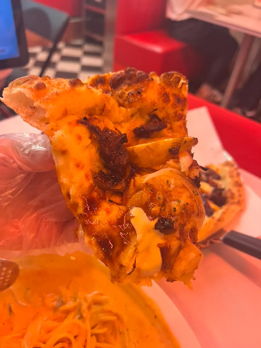 Close-up of 1987 Steak Pizza toppings