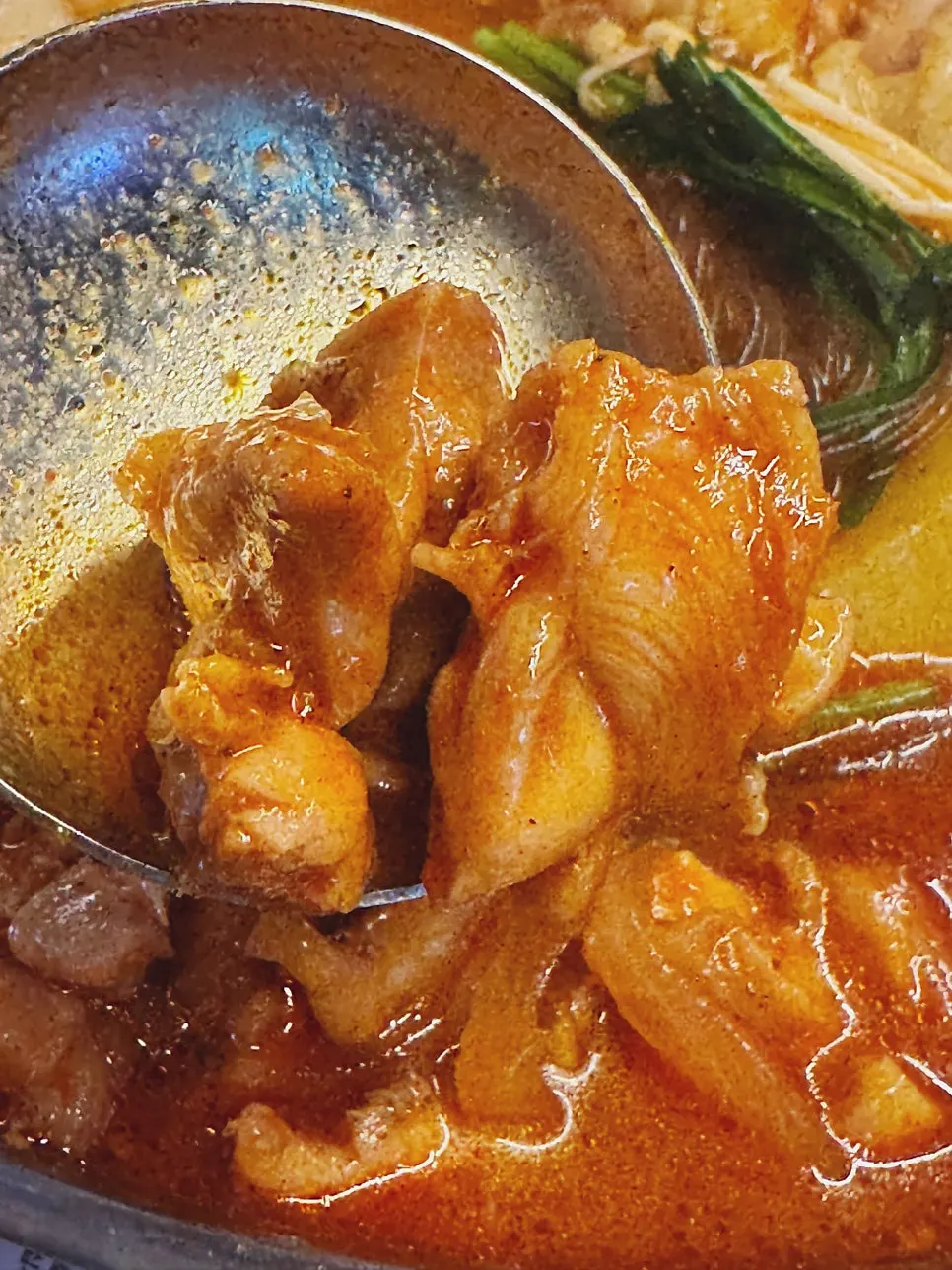 Chewy daechang scooped up from the pot