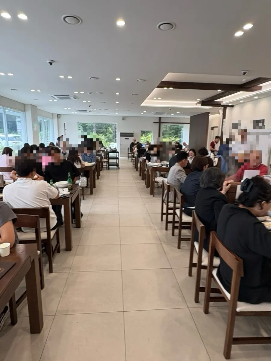 The restaurant interior, busy even on a rainy weekday