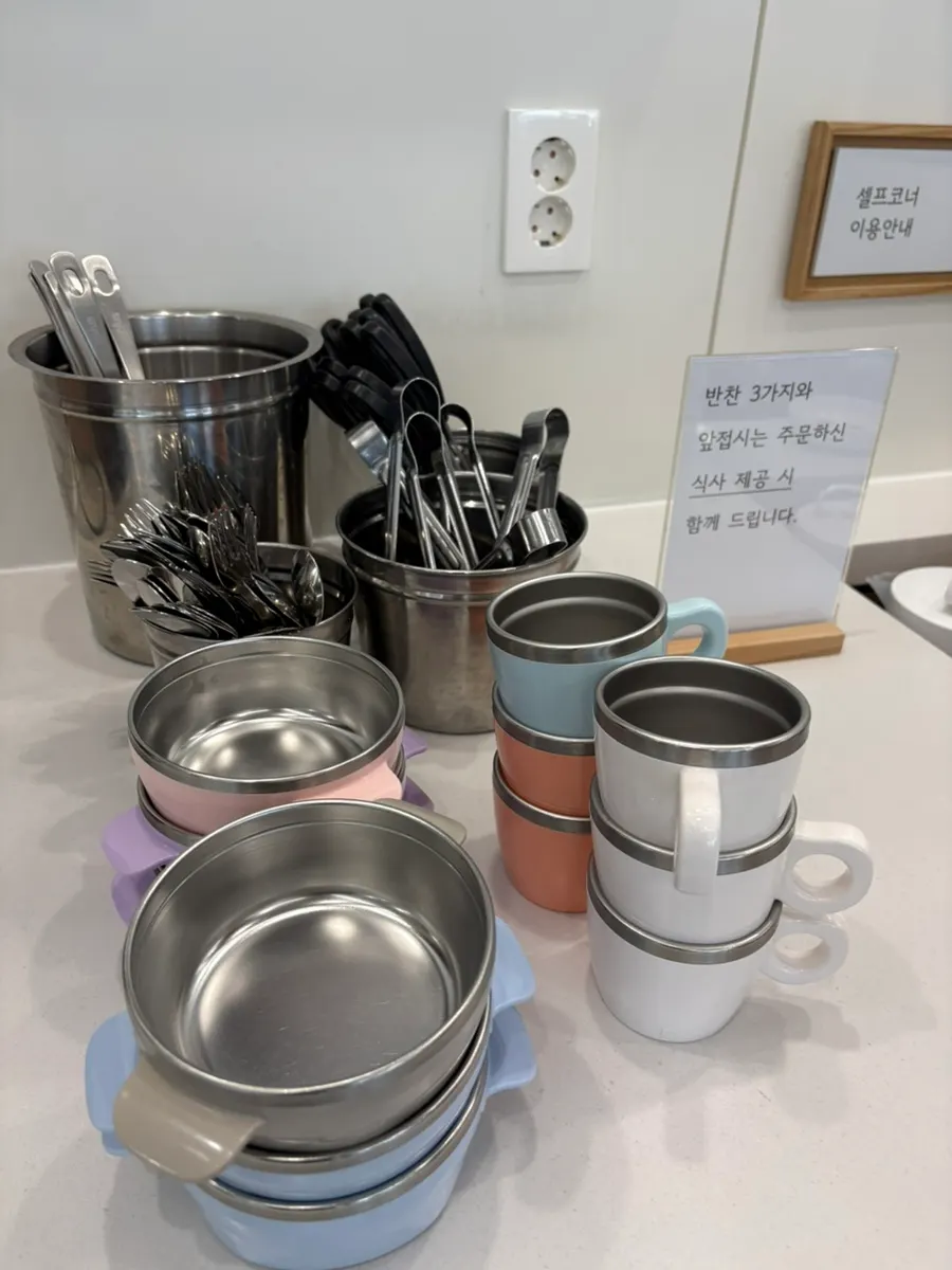 Self-service corner with side dishes and broth