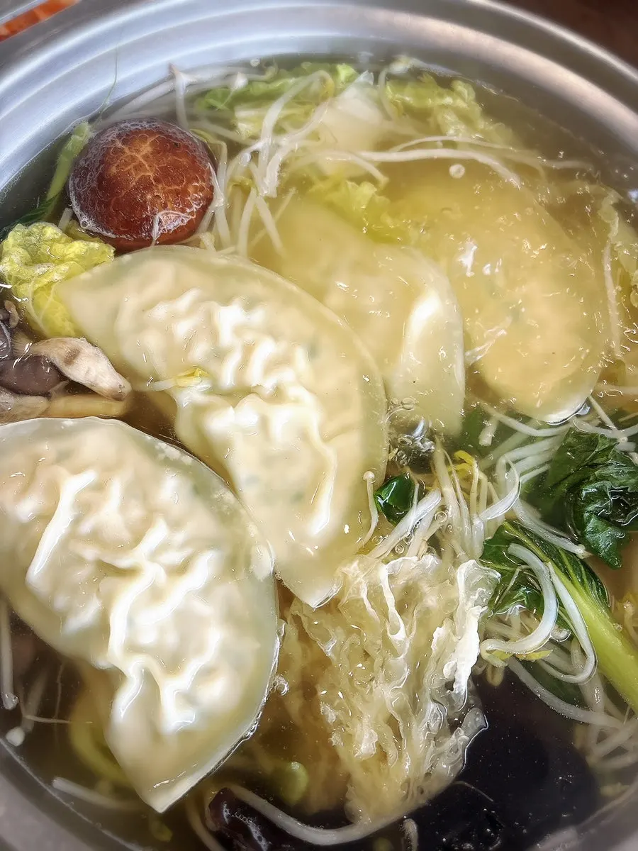 Mandu simmering in the boiling broth