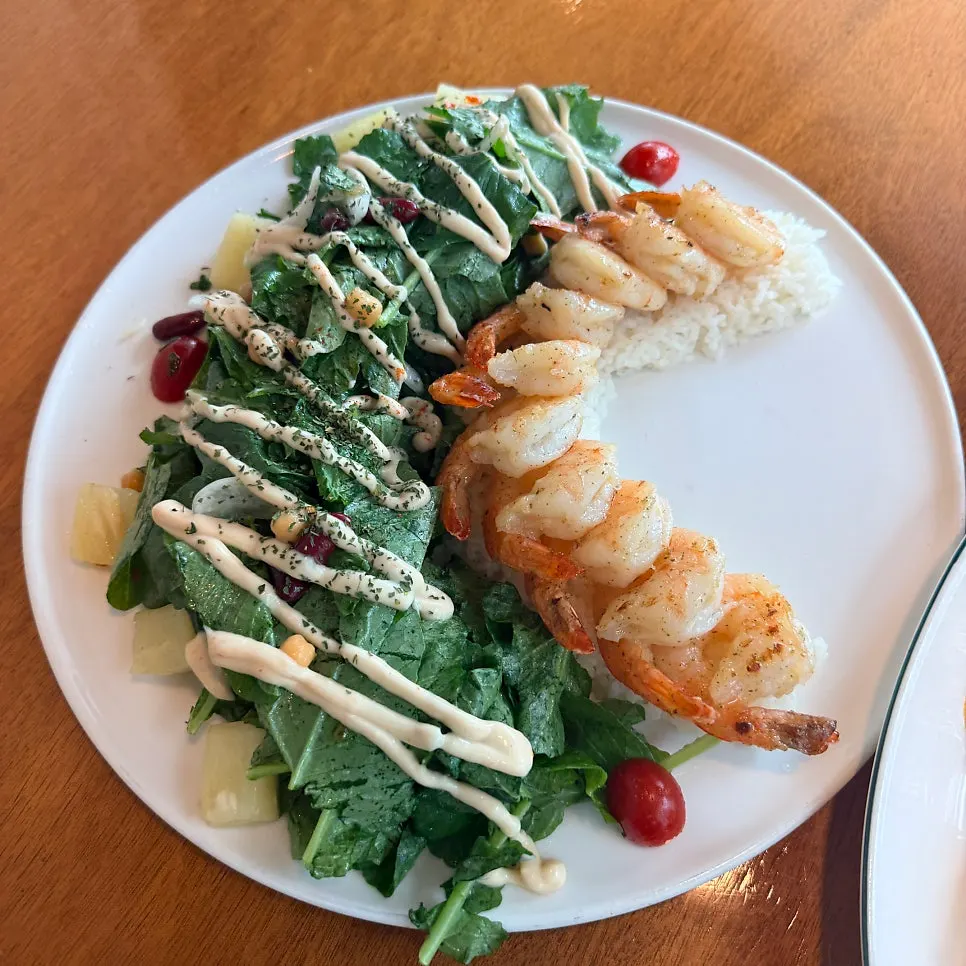 Butter garlic shrimp plate with shrimp, salad, and rice