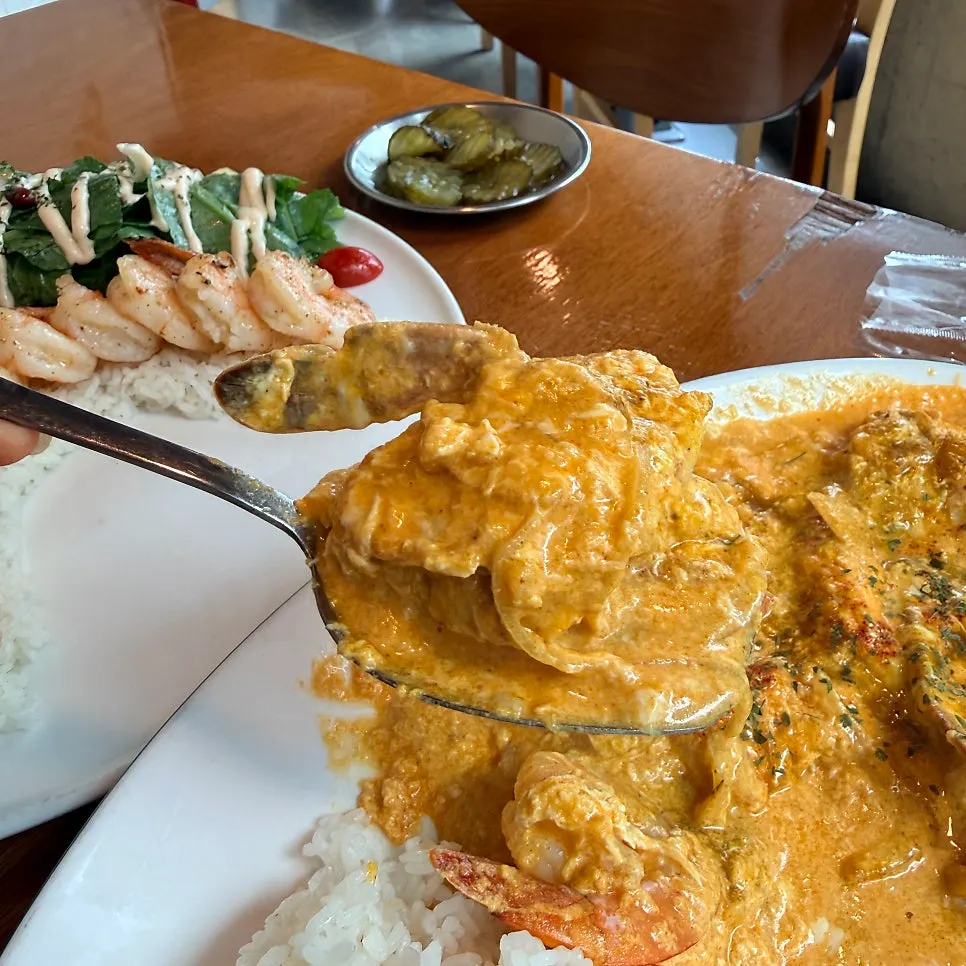 A spoonful of pu pad pong curry with crab meat