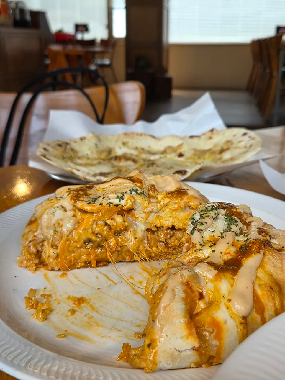 Nasi goreng cut open showing filling and cheese inside