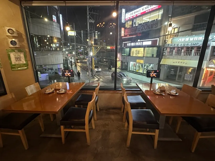 Interior of Rama & Babana lined with floor-to-ceiling windows