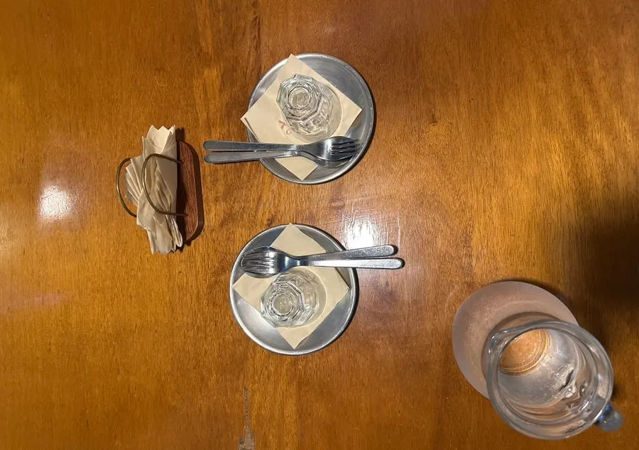 Table setting with plates for two and water