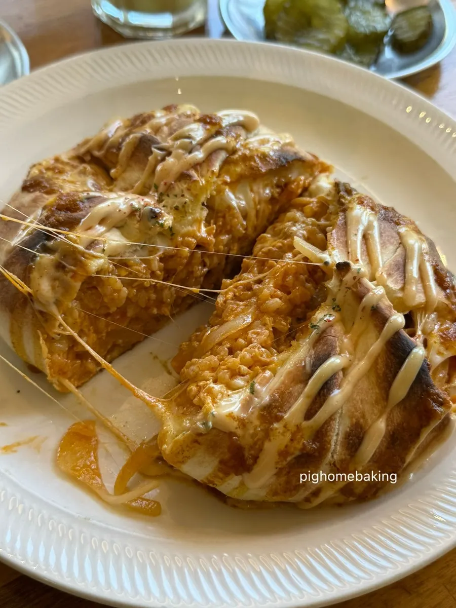 Cross-section of the nasi goreng with stretchy cheese