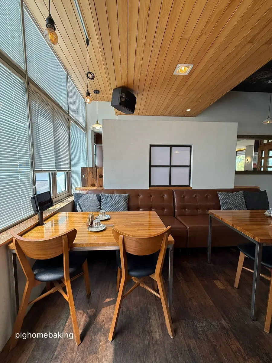 Restaurant interior in wood and white tones