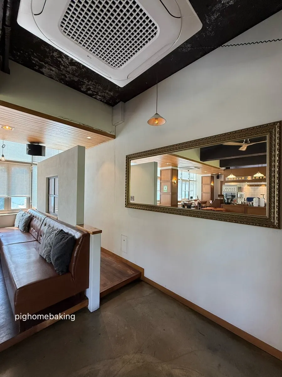 Restroom entrance area with a mirror