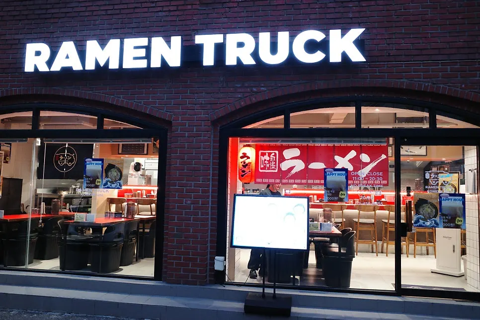 Ramen Truck sign on the first floor of a red brick building