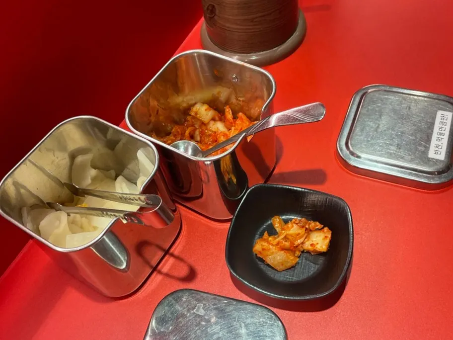 Kimchi and pickled radish set out on the table