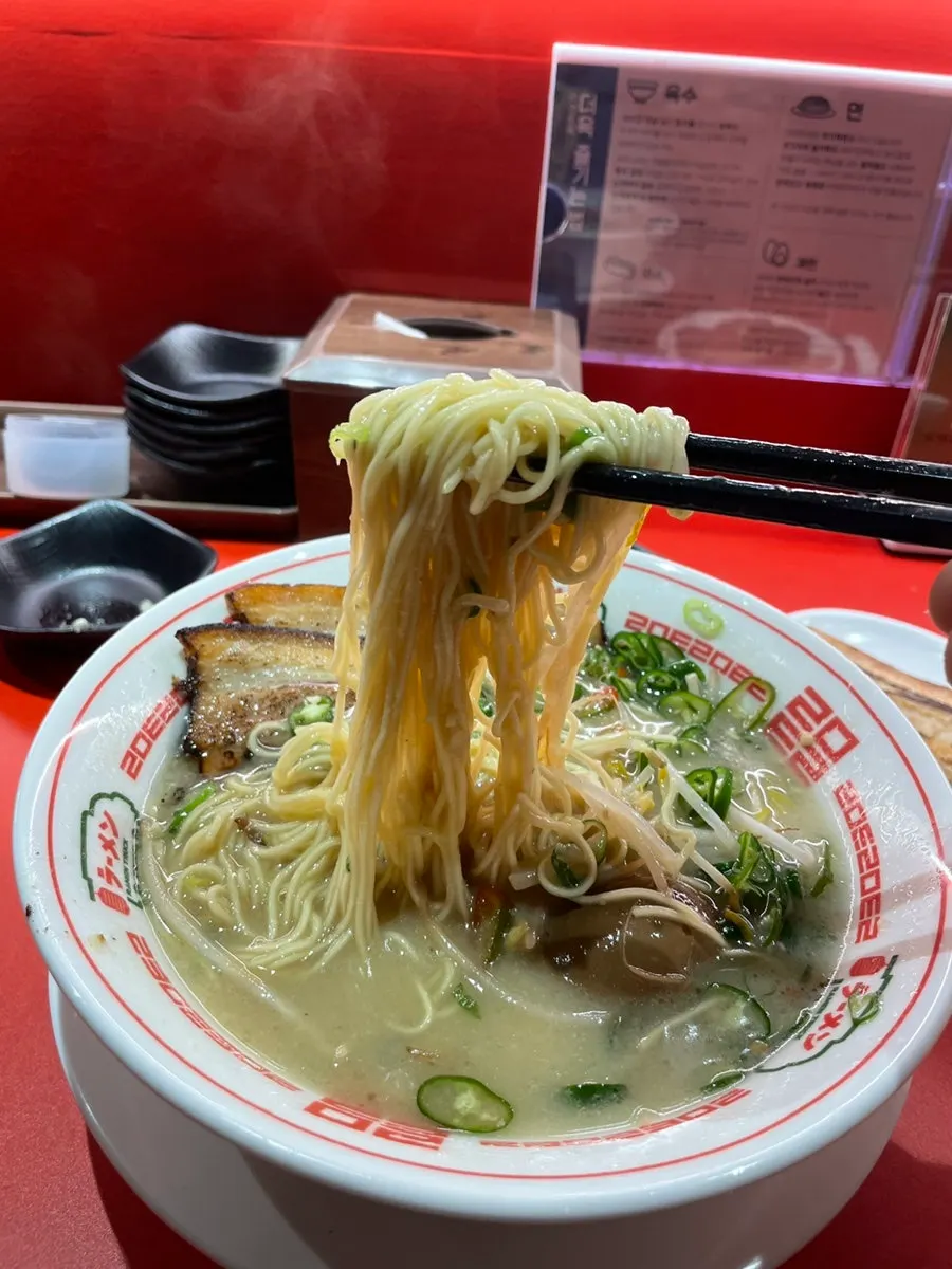 A full spread of chashu ramen eaten at the bar table