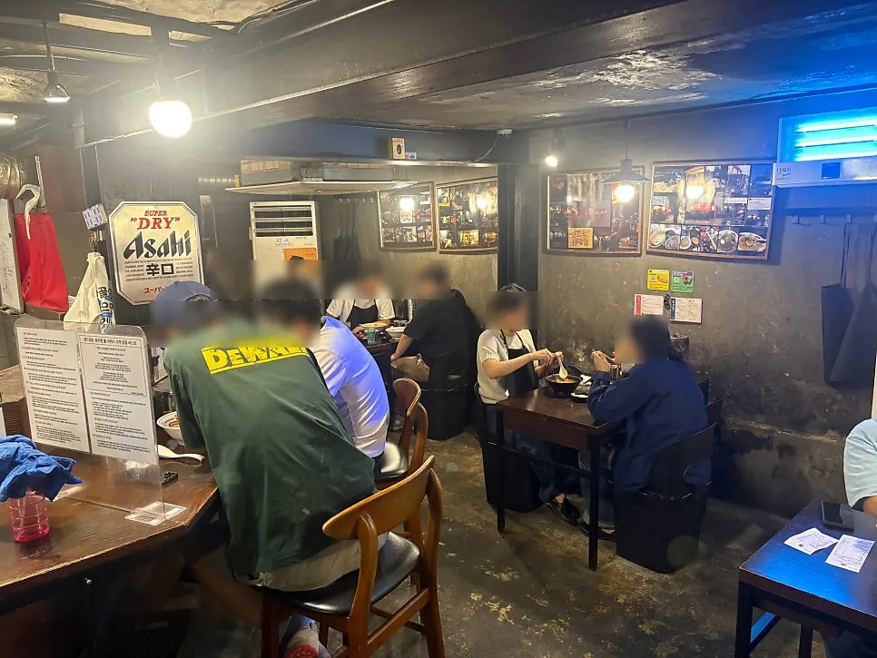 Interior with bar table and tables for four
