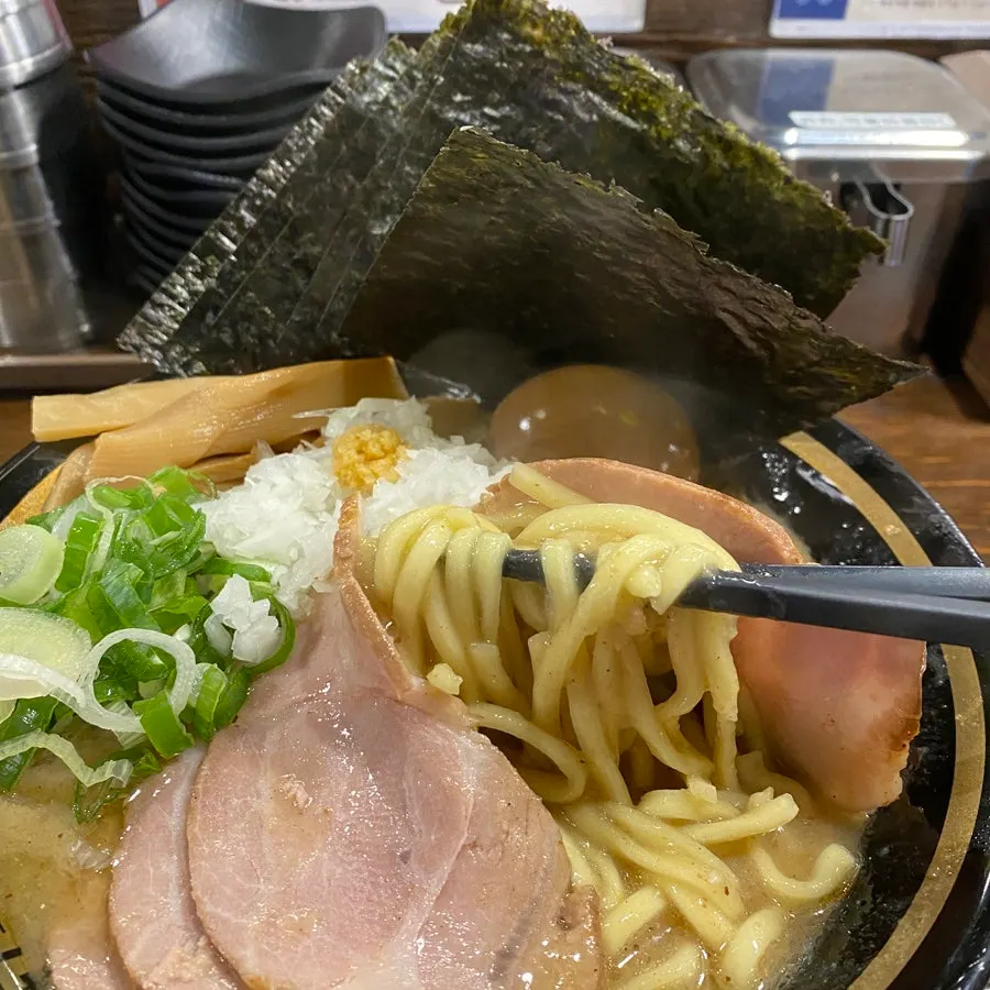 Ieke ramen eaten with chashu wrapped in seaweed