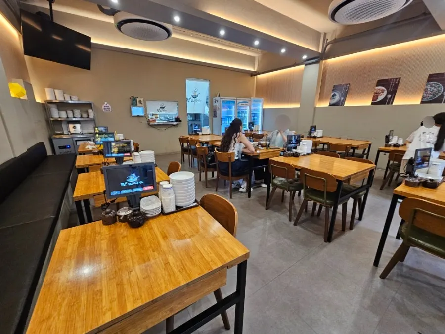 Wooden tables inside Ranchalguksu
