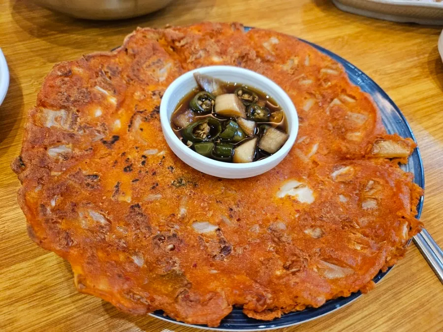 Suyuk served alongside side dishes at the table