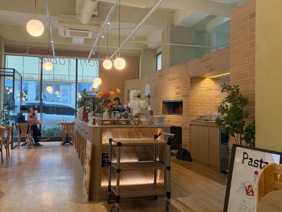 Wood-fired pizza station next to the cashier