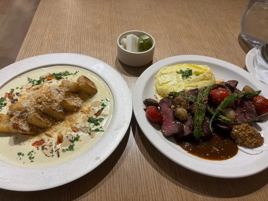 Table set with steak and gnocchi