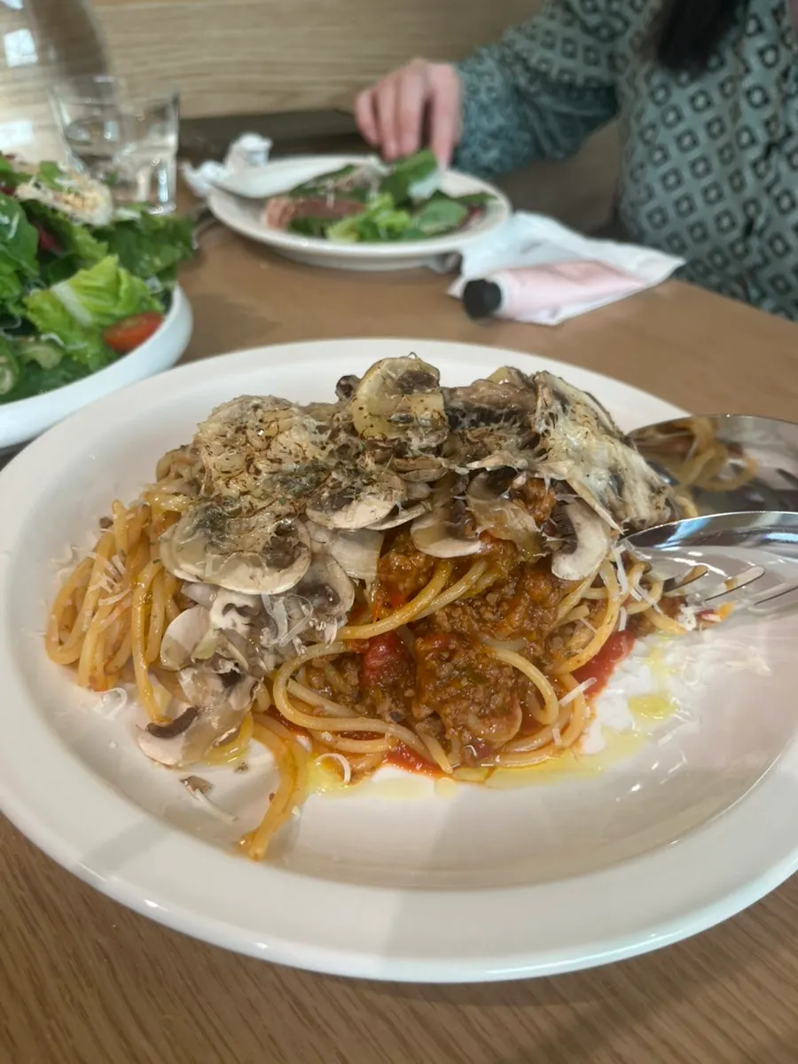Close-up of tomato pasta loaded with mushrooms