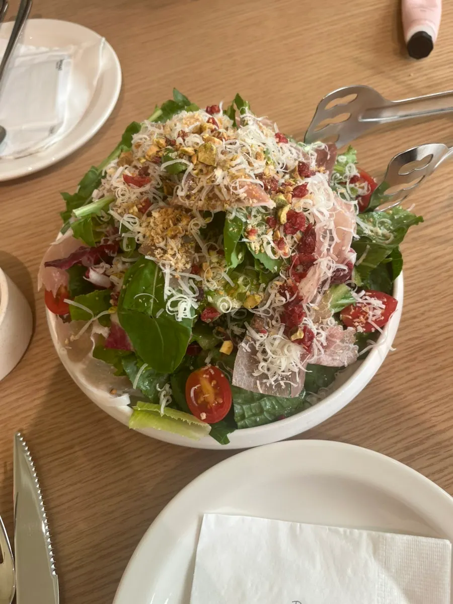 Close-up of salty ham on top of the salad