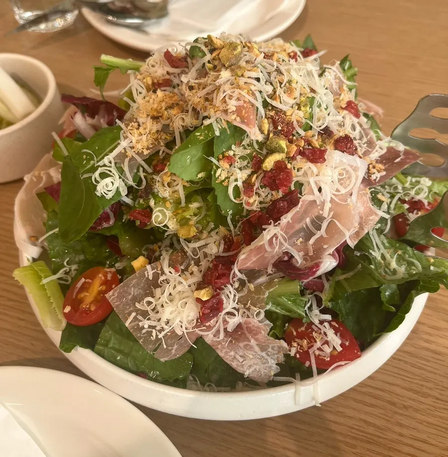 Scooping up a portion of the salad
