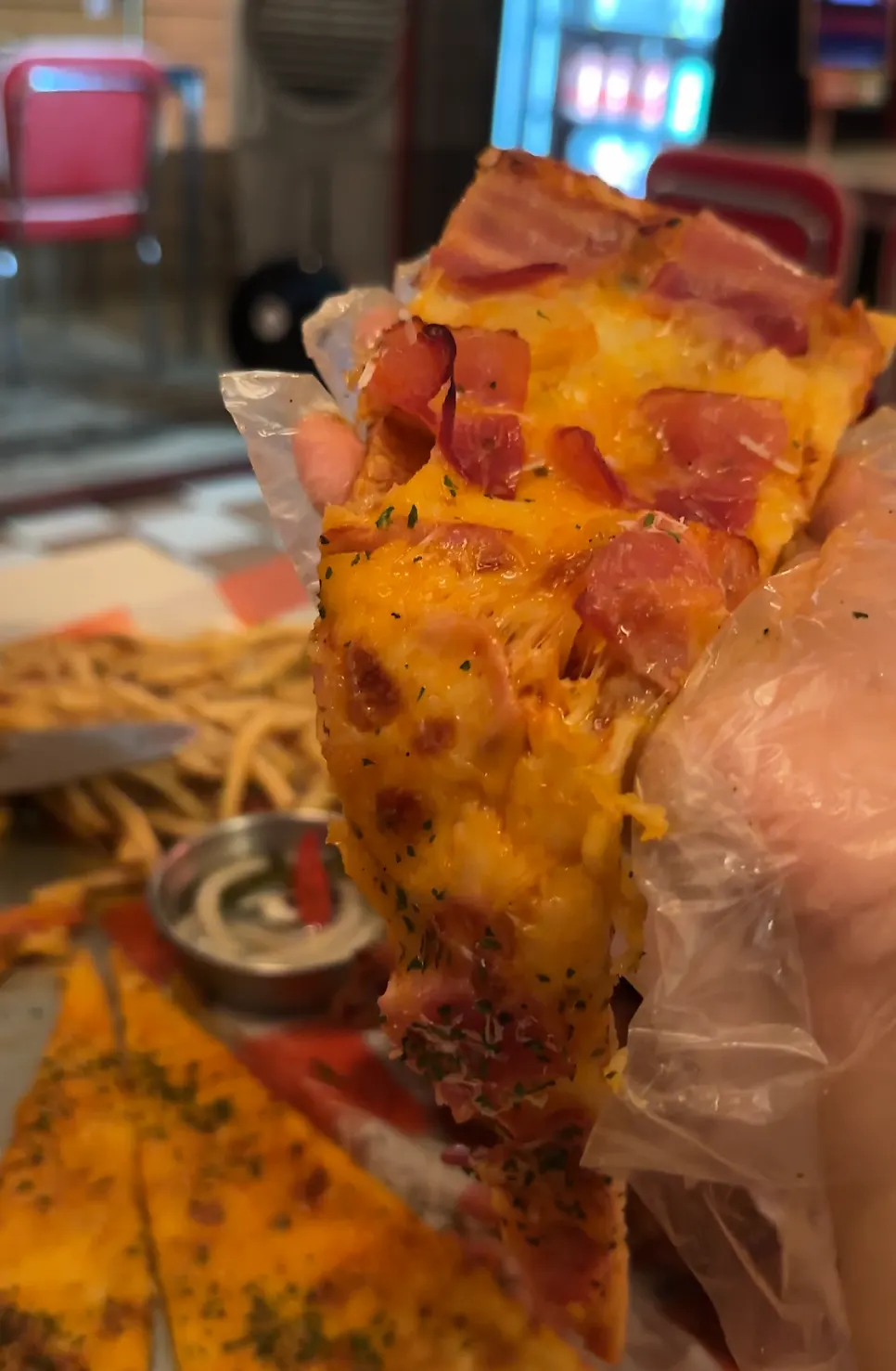 Bacon hawaiian pizza topped with bacon and pineapple