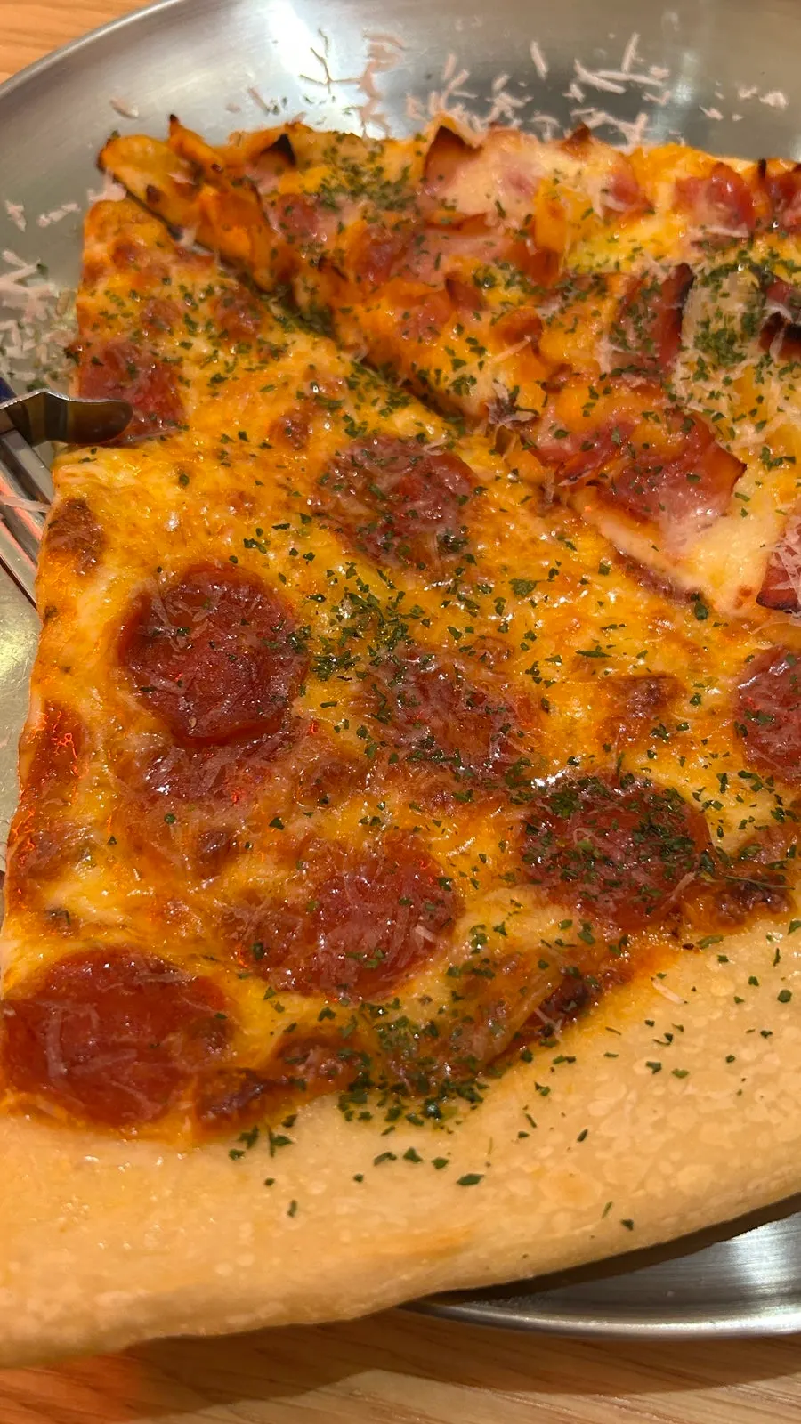 Big-size slice pizza on a large plate