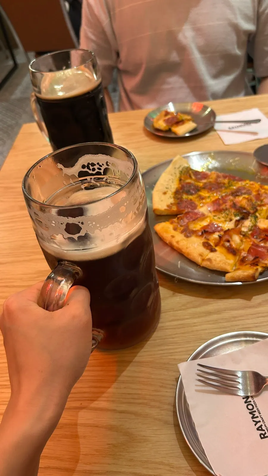 A 1-liter beer mug about the size of a human face