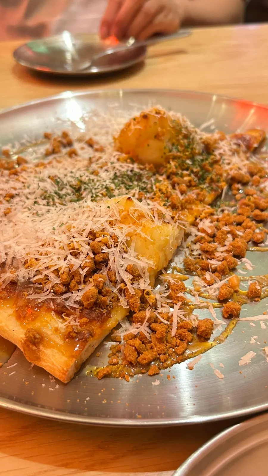 Cross-section of a slice topped with potato