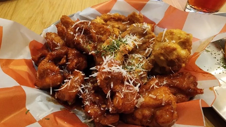Pizza, chicken, craft beer, and ade combo