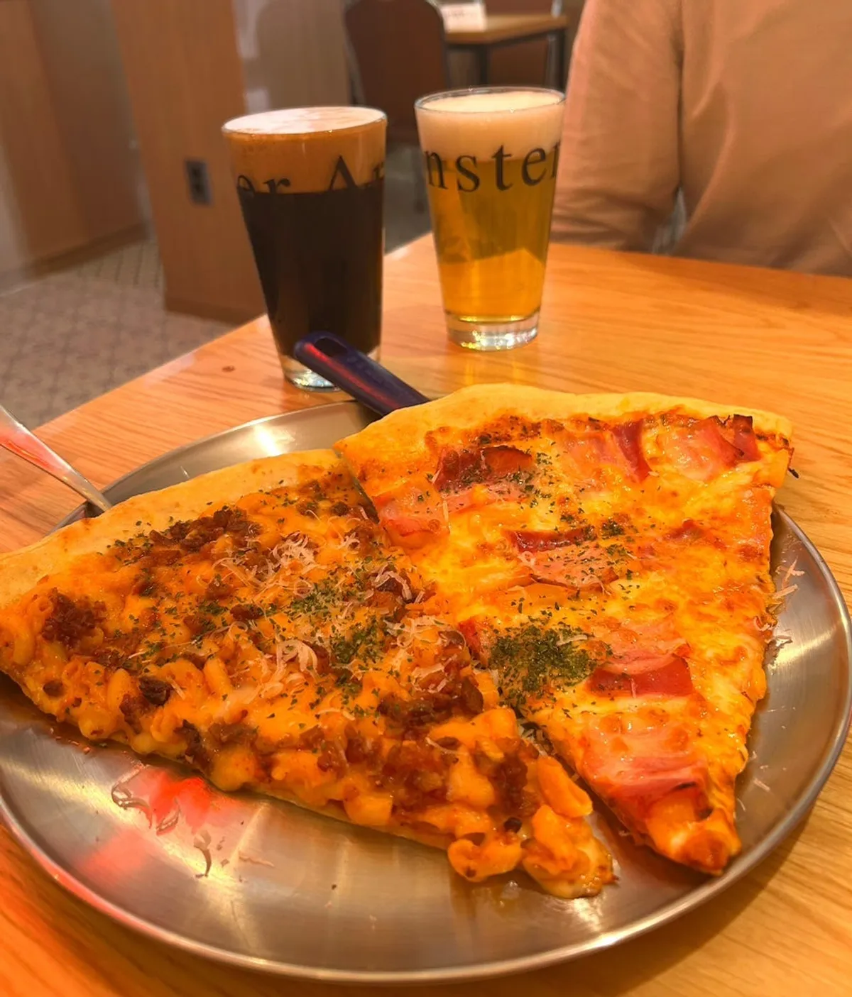 Signature photo of pizza and beer at Raymond Isu Branch