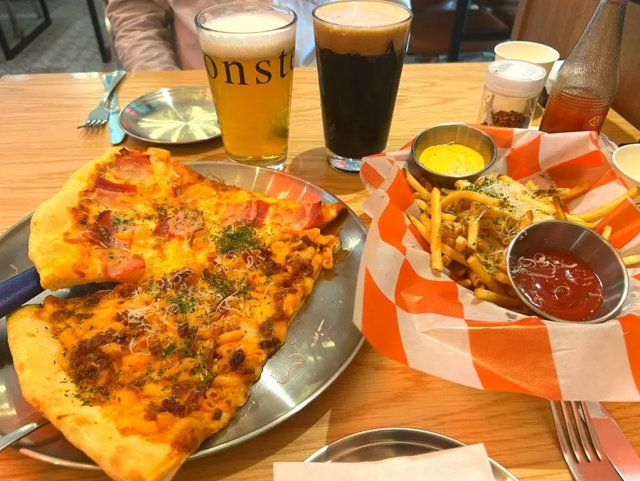 Overhead shot of the table with pizza and beer