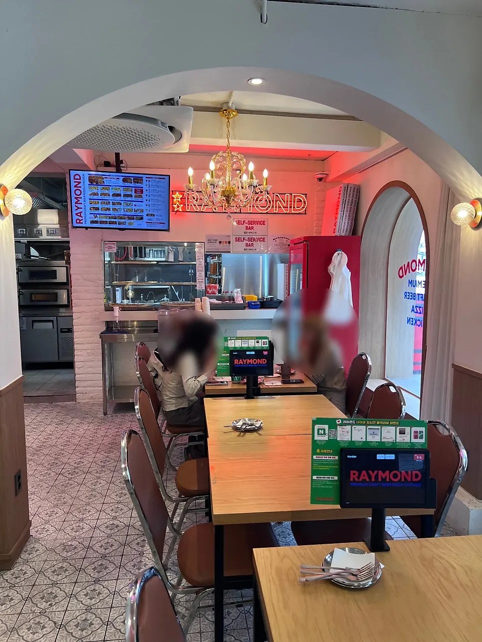 Interior of Raymond Isu Branch with wallpaper and chandelier